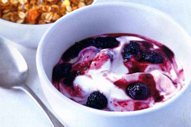 Berries in syrup on yoghurt