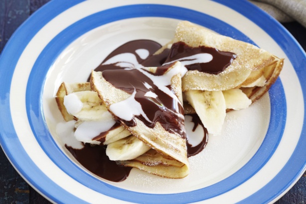 Coconut pancakes with banana and chocolate sauce