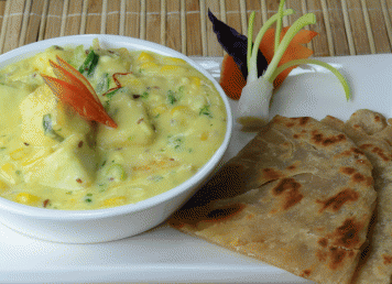 Corn and cheese with saffron sauce